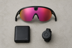 Cycling accessories laid out together including camera glasses and a controller